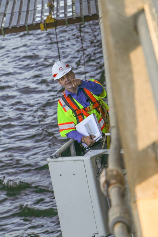Lyle Peterson, civil engineer, U.S. Army Corps of Engineers, Omaha District, uses a snooper to inspect the underside of one of the bridges spanning the Missouri River at the Big Bend Dam near Fort Thompson, S.D.