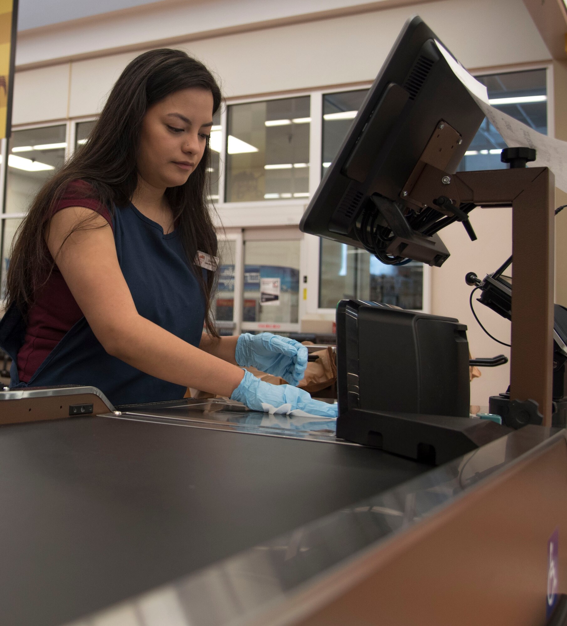 Woman sanitizes area