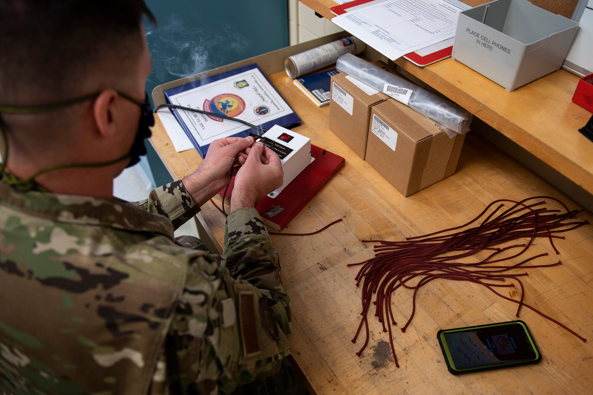 ALTUS AIR FORCE BASE, Okla. - U.S. Air Force Tech. Sgt. Jeremy Gutsch, the Assistant Flight chief of Air Crew Flight Equipment (AFE) assigned to the 97th Operations Support Squadron, prepares materials for making face masks for base members, April 6, 2020 at Altus Air Force Base Oklahoma.
