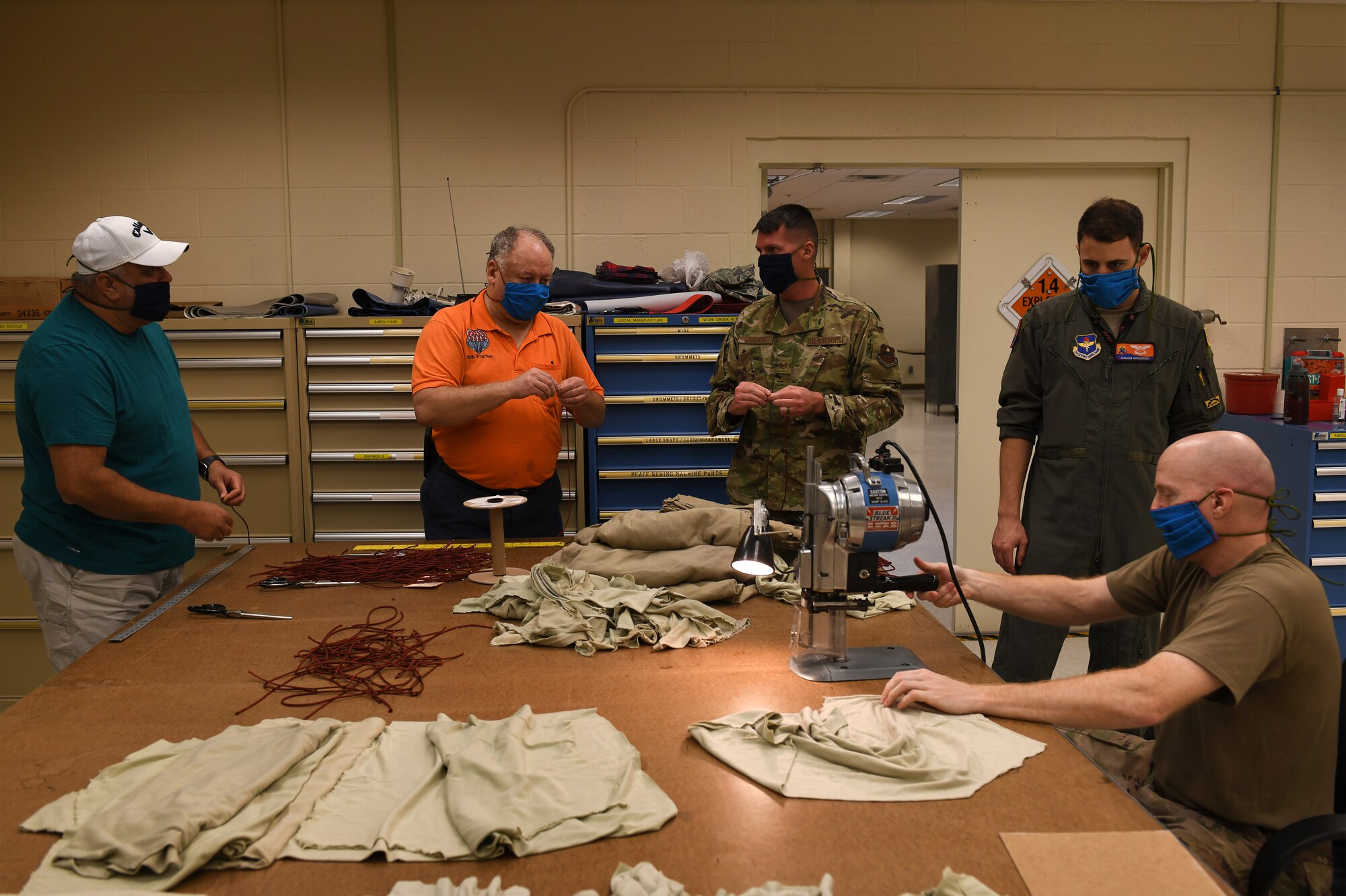 ALTUS AIR FORCE BASE, Okla. - Members of the 97th Operations Support Squadron, Air Crew Flight Equipment (AFE) flight, assemble face masks for base members, April 6, 2020 at Altus Air Force Base Oklahoma.