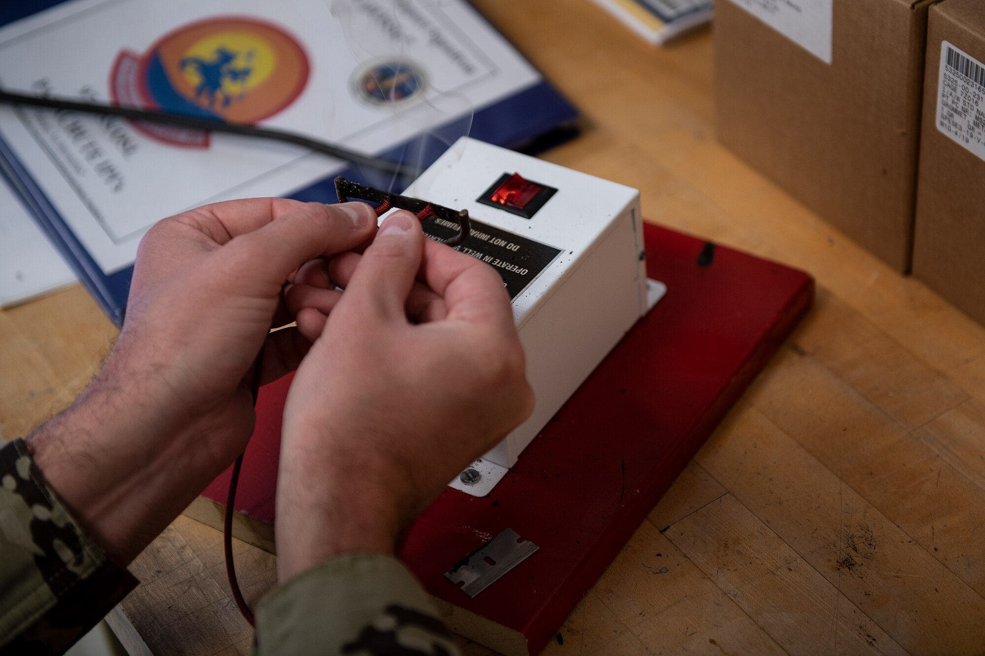 ALTUS AIR FORCE BASE, Okla. - U.S. Air Force Tech. Sgt. Jeremy Gutsch, the Assistant Flight chief of Air Crew Flight Equipment (AFE) assigned to the 97th Operations Support Squadron, prepares materials for making face masks for base members, April 6, 2020 at Altus Air Force Base Oklahoma.