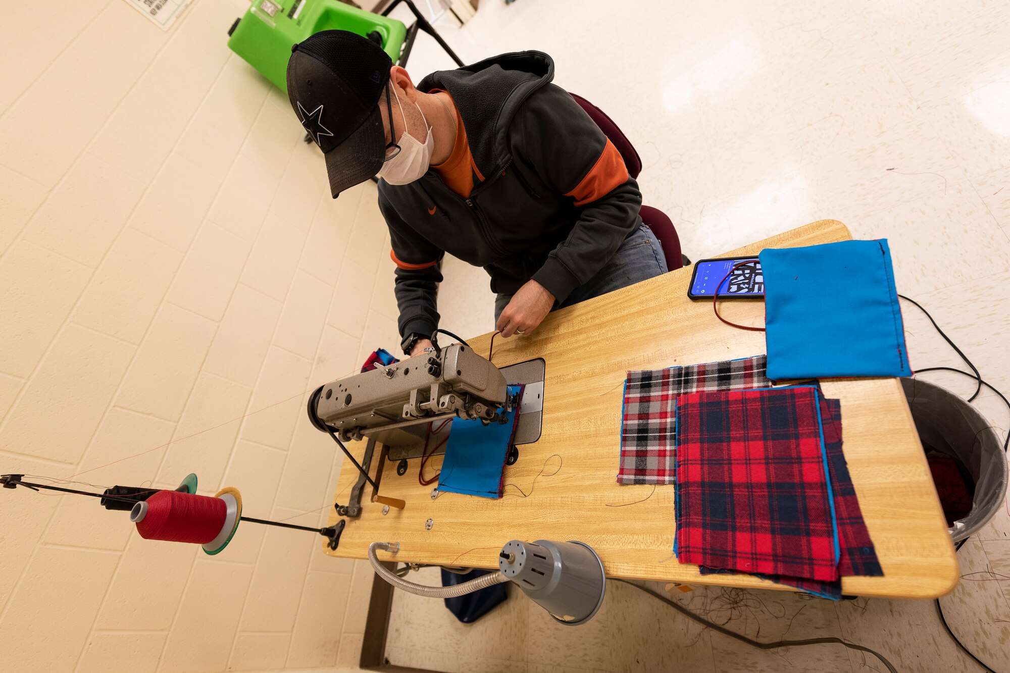 ALTUS AIR FORCE BASE, Okla. - U.S. Air Force Master Sgt. Robert Whisenhunt, the Flight chief of Air Crew Flight Equipment (AFE) assigned to the 97th Operations Support Squadron, sews face masks for base members, April 6, 2020 at Altus Air Force Base Oklahoma.