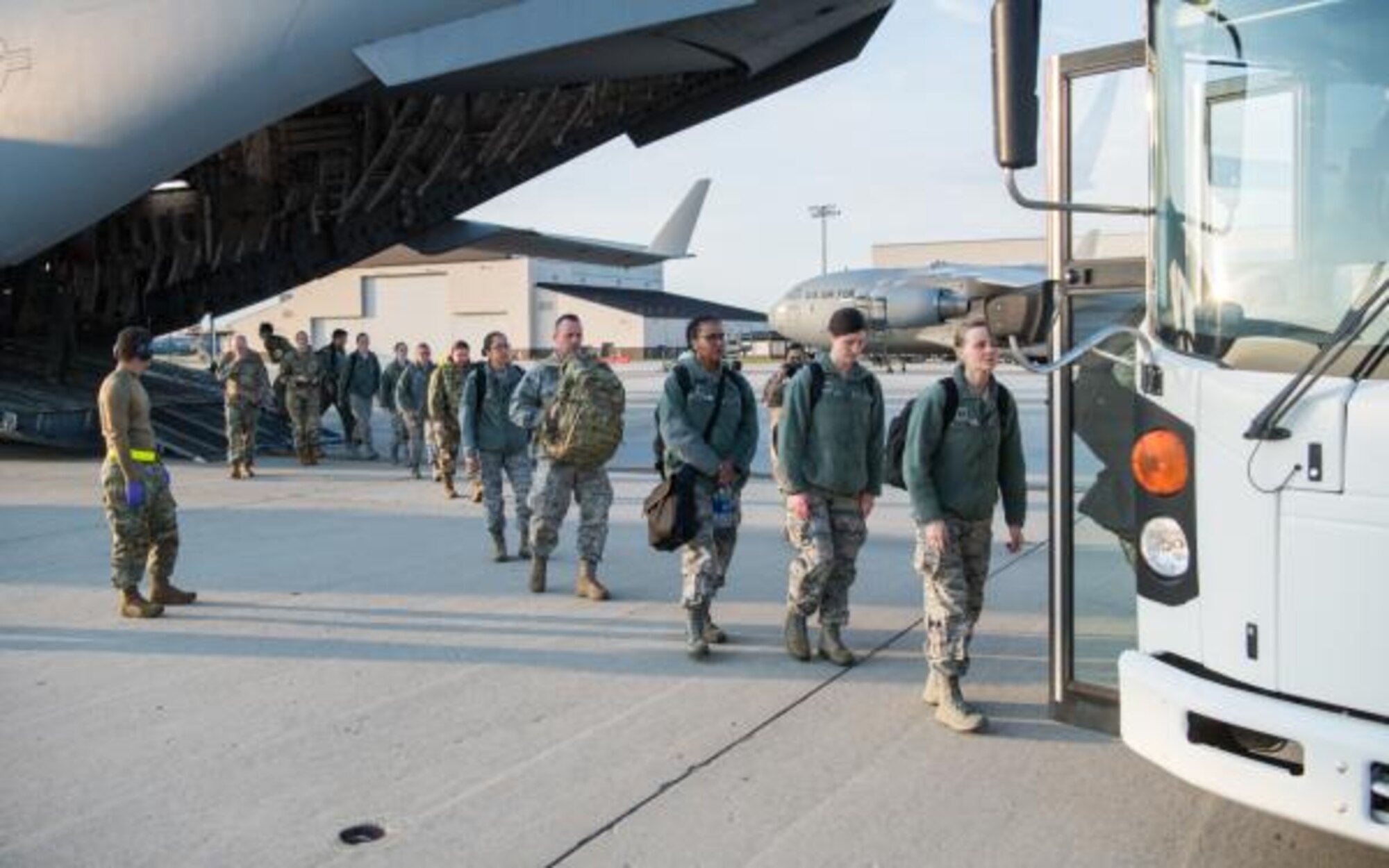 MLS-Medical staff from many bases board the provided transportation after arriving by C-17. The final destination is New York City