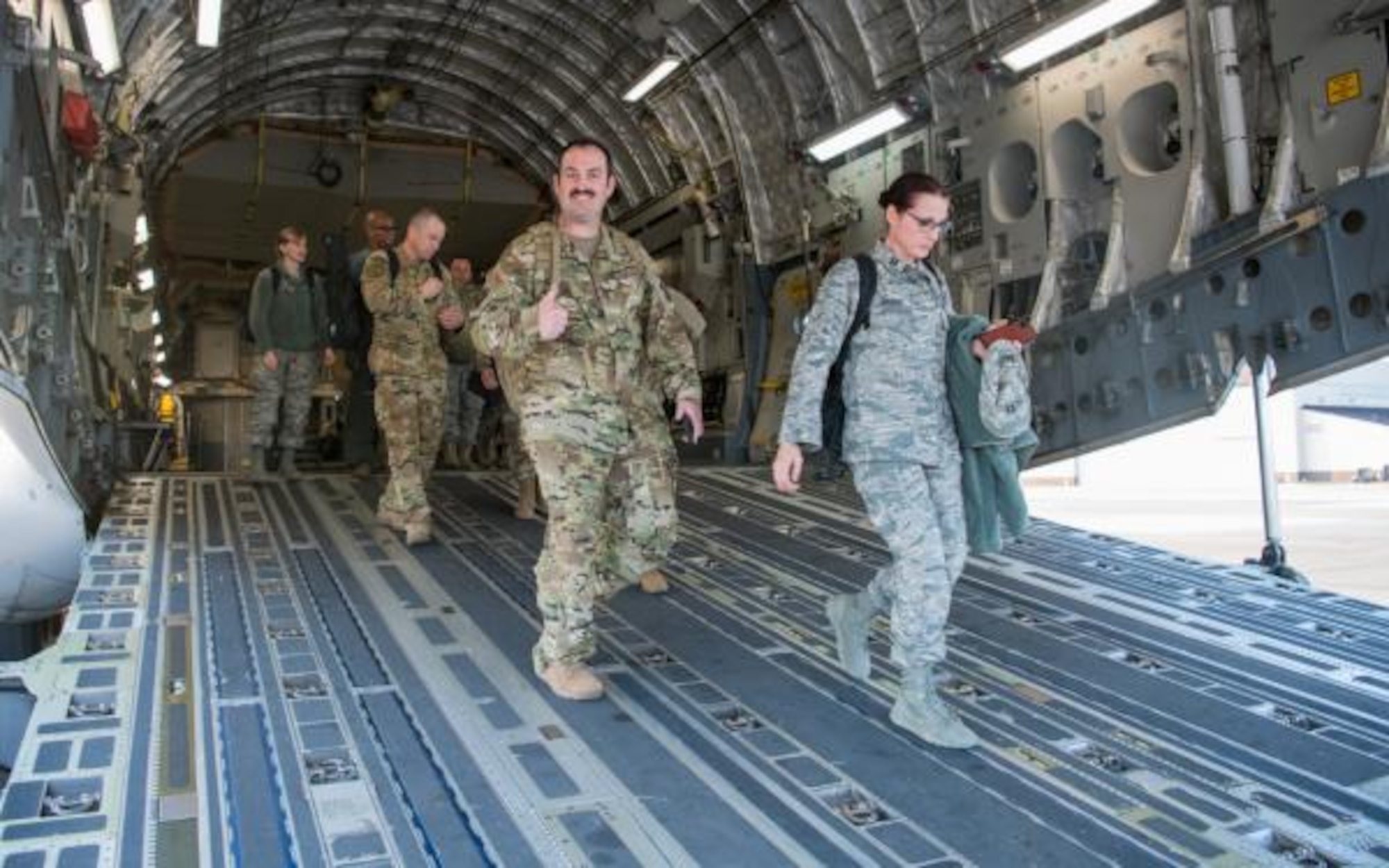 MLS- Reserve medics existing the tail of C-17 at JBMDL in New Jersey on April 5, 2020  of AMDS personnel existing C-17 at tail located at Joint Base McQuire on 5 April 2020. to support New York state's medical emergency of COVID-19.