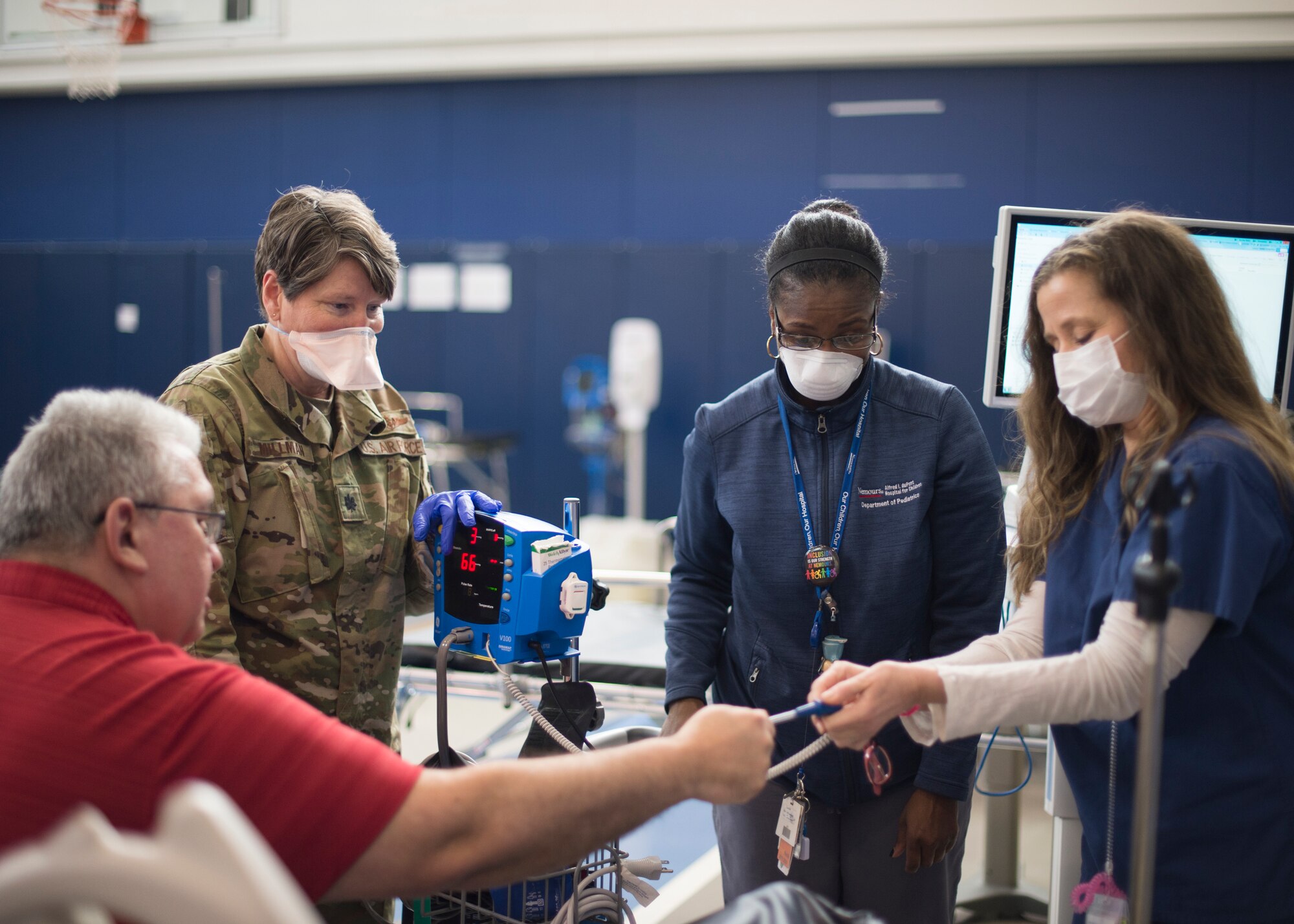 Citizen Airmen and medical staff from Nemours/Alfred I. DuPont Hospital for Children, Christiana Care, and St. Francis Healthcare check vital signs during a training exercise at an alternate care site at A.I. DuPont Hospital, Wilmington, Del., April 7, 2020. The team’s mission, in support of the FEMA Federal Emergency Management Agency and the Delaware Emergency Management Agency is to provide prescreened adult non-COVID-19 patients with care. (U.S. Air National Guard Photo by Staff Sgt. Katherine Miller)