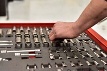 Senior Airman Mathew Bowen, a 354th Logistics Readiness Squadron vehicle maintenance journeyman, selects a socket for repair work at Eielson Air Force Base, Alaska, April 8, 2020. Vehicle mechanics are meticulous in organizing their tools to ensure accountability of all assets. (U.S. Air Force photo by Senior Airman Beaux Hebert)