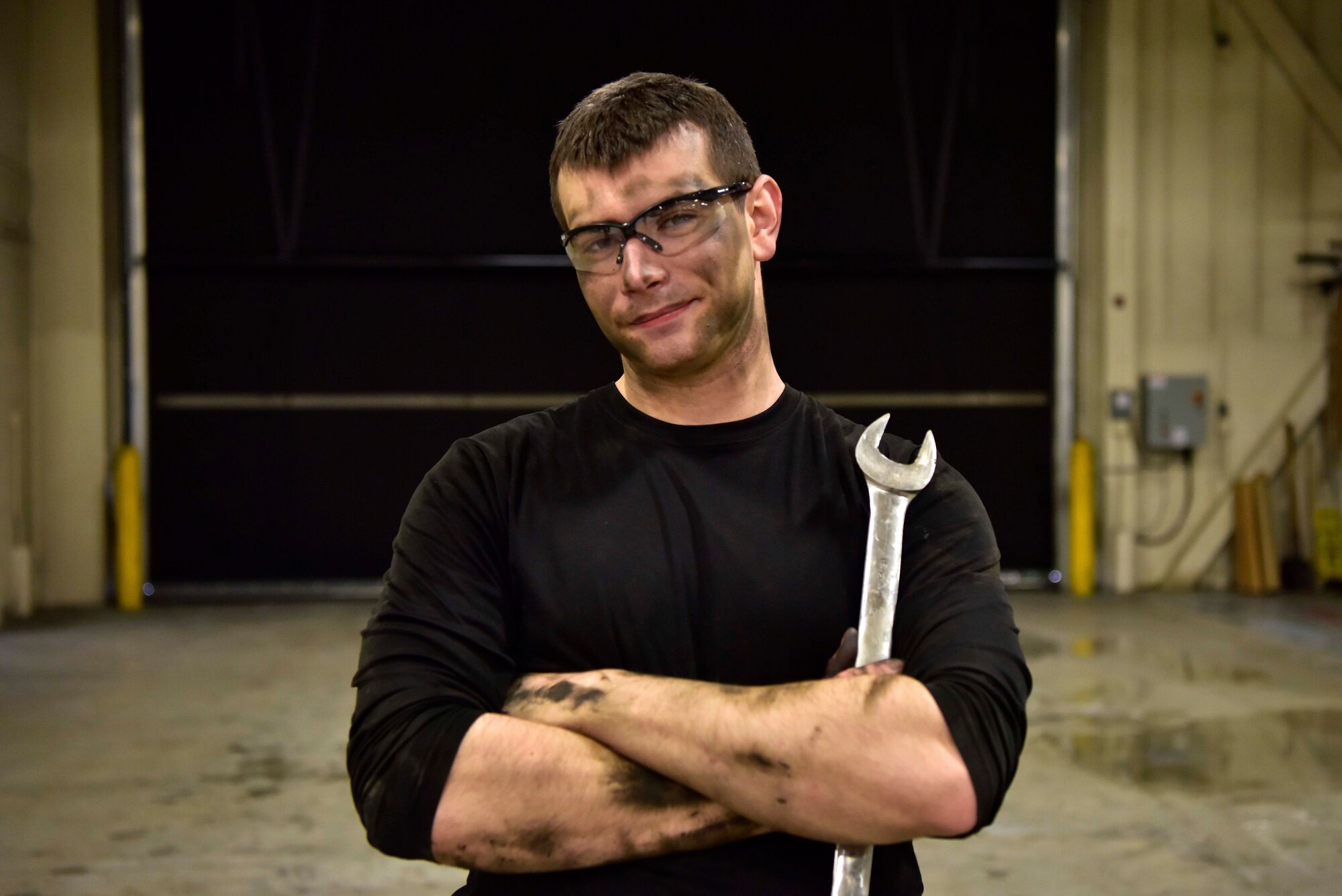 Senior Airman Mathew Bowen, a 354th Logistics Readiness Squadron vehicle maintenance journeyman, takes a brief break from working to pose for a photo at Eielson Air Force Base, Alaska, April 8, 2020. Bowen is a second-generation Air Force vehicle mechanic; his father, former Senior Airman Tom Bowen, served from 1991-1995. (U.S. Air Force photo by Senior Airman Beaux Hebert)