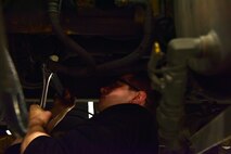 Senior Airman Mathew Bowen, a 354th Logistics Readiness Squadron vehicle maintenance journeyman, loosens an air hose on an Oshkosh H-series Broom on Eielson Air Force Base, Alaska, April 8, 2020. Vehicle mechanics have to work in tight spaces to repair equipment and cannot be afraid to get dirty. (U.S. Air Force photo by Senior Airman Beaux Hebert)