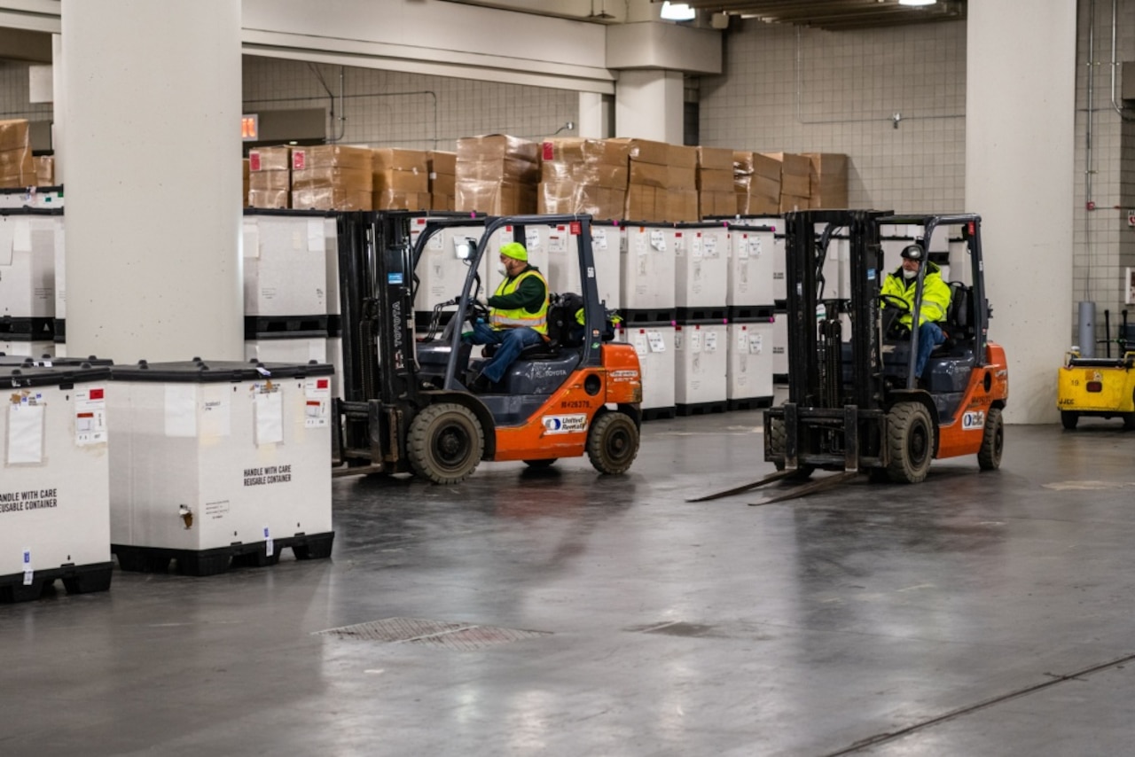 Workers gather supplies for a hospital.