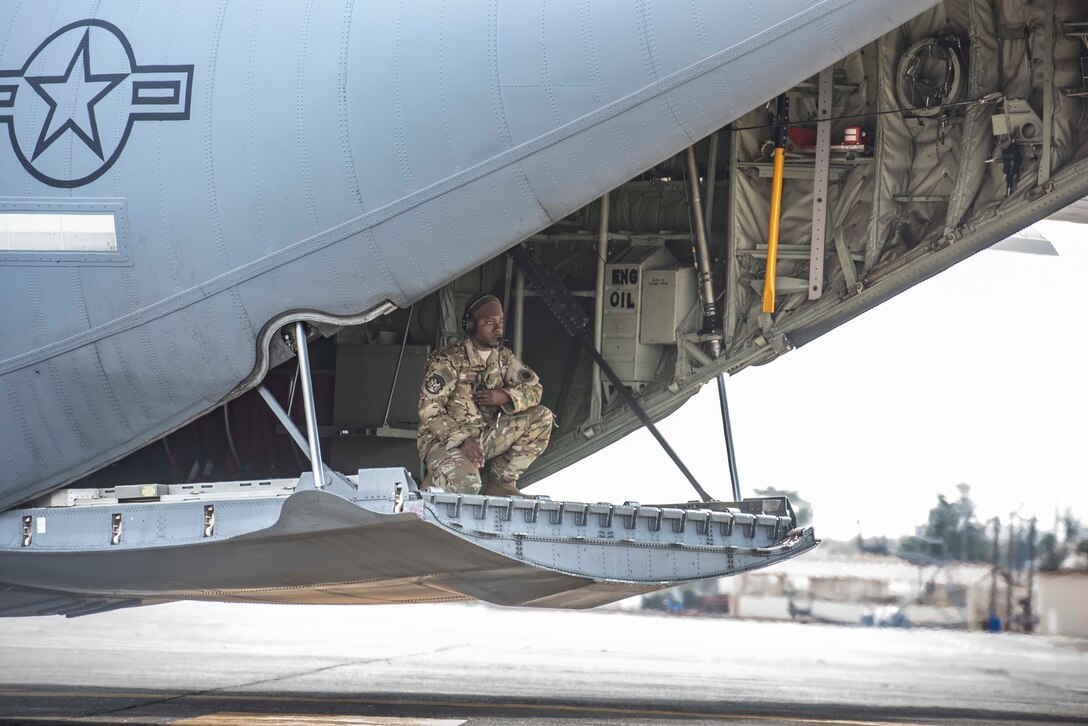 Staff Sgt. Marcus Wright, 36th Airlift Squadron loadmaster, communicates with his C‐130J Super Hercules pilot as the aircraft reverse taxis during the Yokota C‐130J Tactics Rodeo April 3, 2020, at Yokota Air Base, Japan.