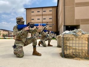 Trainees in basic military training (BMT) learn defensive fighting positions in preparation for BEAST (Basic Expeditionary Airman Skills Training) on Joint Base San Antonio-Lackland, Texas, April 8. This was the first day mask wear was implemented at BMT as a required safety measure during the COVID-19 pandemic.