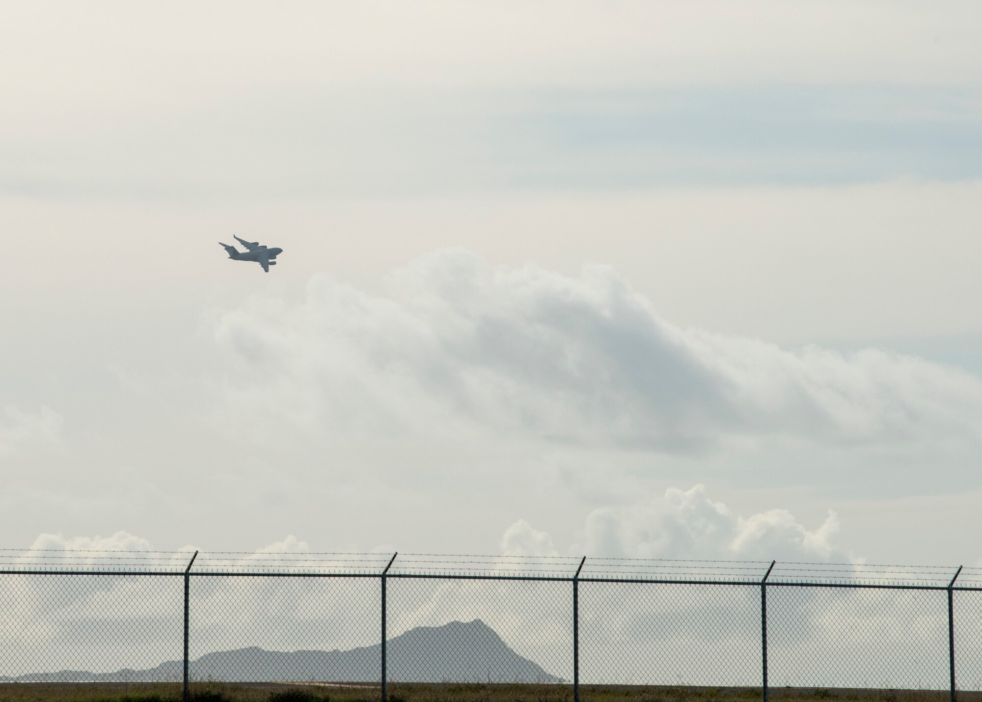 A C-17 Globemaster III departs from Joint Base Pearl Harbor-Hickam, Hawaii, April  3, 2020. The C-17 is assigned to the  535th Airlift Squadron, JBPHH.  (U.S. Air Force photo by Staff. Sgt. Mikaley Kline )