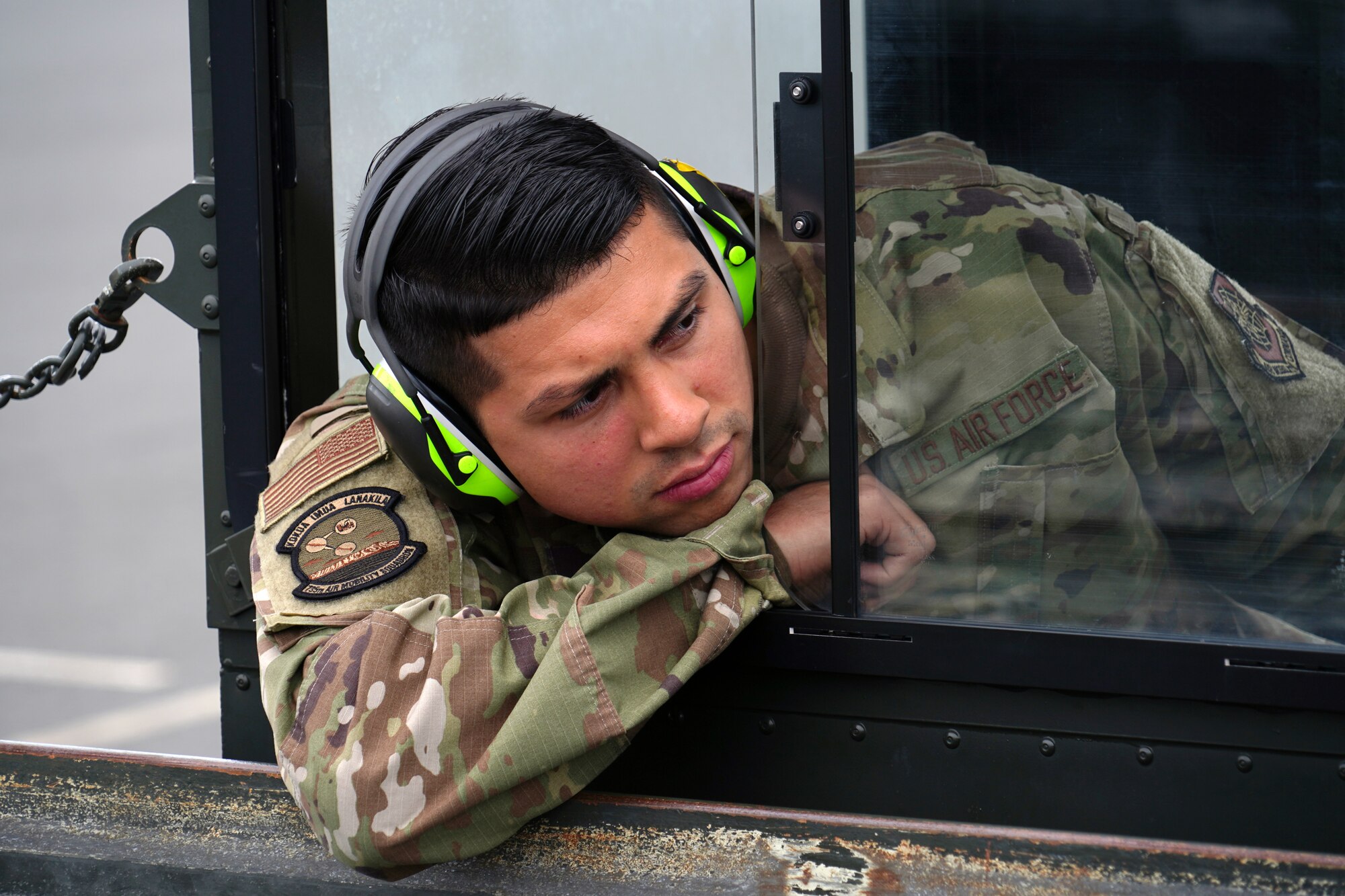 U.S. Air Force Senior Airman Mario Garcia, 735th Air Mobility Squadron air freight journeyman, observes his entry point while driving a Tunner 60K loader toward the dock at Joint Base Pearl Harbor-Hickam, Hawaii, March 31, 2020. The 735th AMS  supports the Indo-Pacific region  during the COVID-19 pandemic by transporting supplies to those in need. (U.S. Air Force photo by Airman 1st Class Erin Baxter)