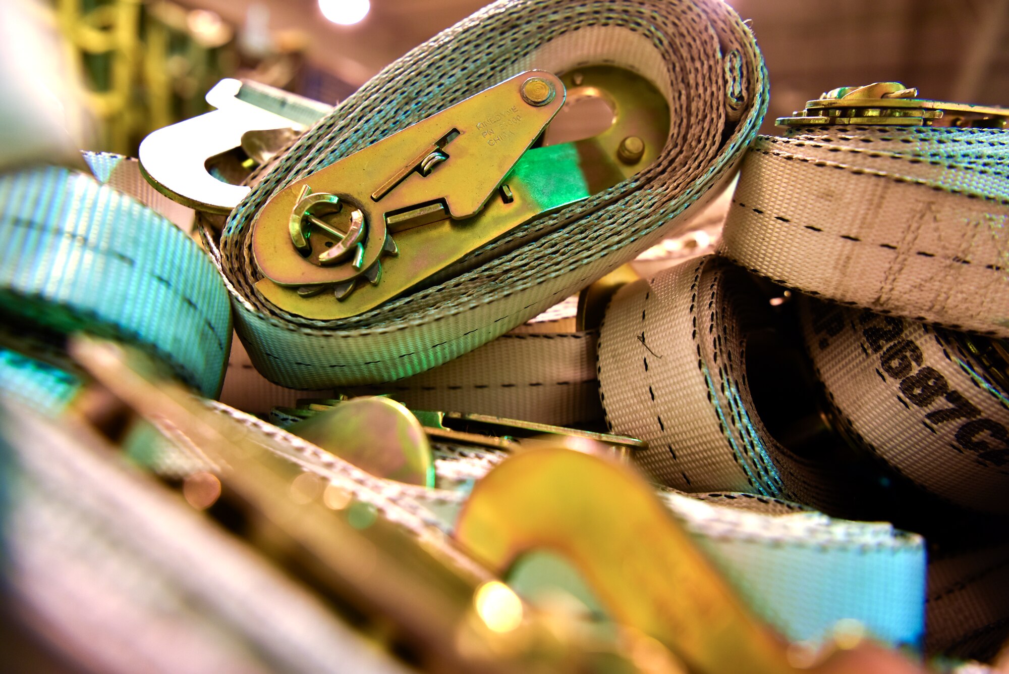A CGU-1/B strap lays in the dock of the 735th Air Mobility Squadron, at Joint Base Pearl Harbor-Hickam, Hawaii, April  3, 2020. The 735th AMS uses various equipment to provide additional restraint for cargo movements. Additionally, the 735th AMS provided support to the Mariana Islands in response to the COVID-19 pandemic.  

 (U.S. Air Force photo by Tech. Sgt. Anthony Nelson Jr.)