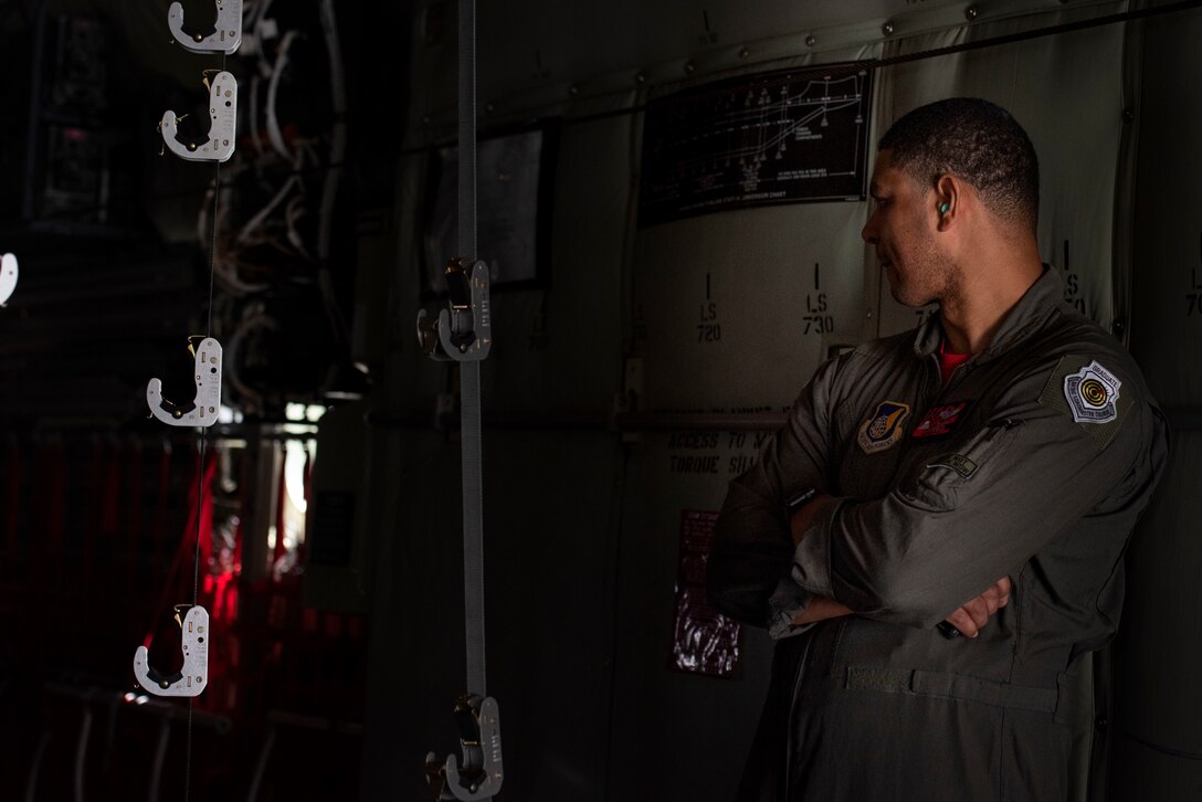 Master Sgt. Napoleon Ortiz, 374th Operations Group group evaluator, observes a loadmasters’s performance during the Yokota C‐130J Tactics Rodeo April 3, 2020, at Yokota Air Base, Japan.