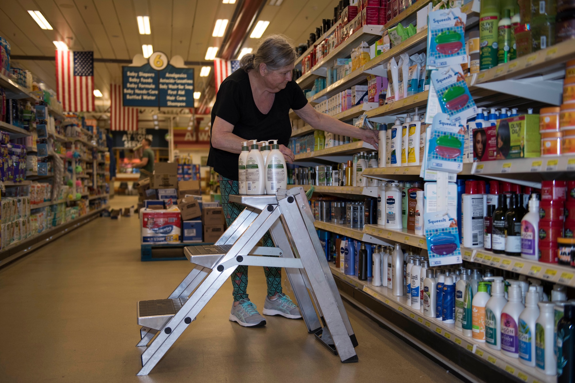 RAF Alconbury and RAF Molesworth employees and volunteers restock shelves at the base commissary at RAF Alconbury England, March 20, 2020. Volunteers answered the call to support the community to ensure service members and their families had access to essential items amid COVID-19. (U.S. Air Force photo by Airman 1st Class Jennifer Zima)