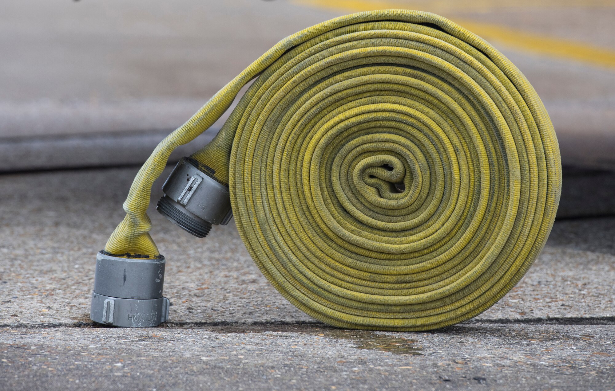 Firefighters with the 423rd Civil Engineer Squadron role up a firehose during confined spaces training at RAF Alconbury, England on March 30, 2020. This type of training helps the firefighters maintain readiness and stay proficient in their craft. (U.S. Air Force photo by Master Sgt. Brian Kimball)