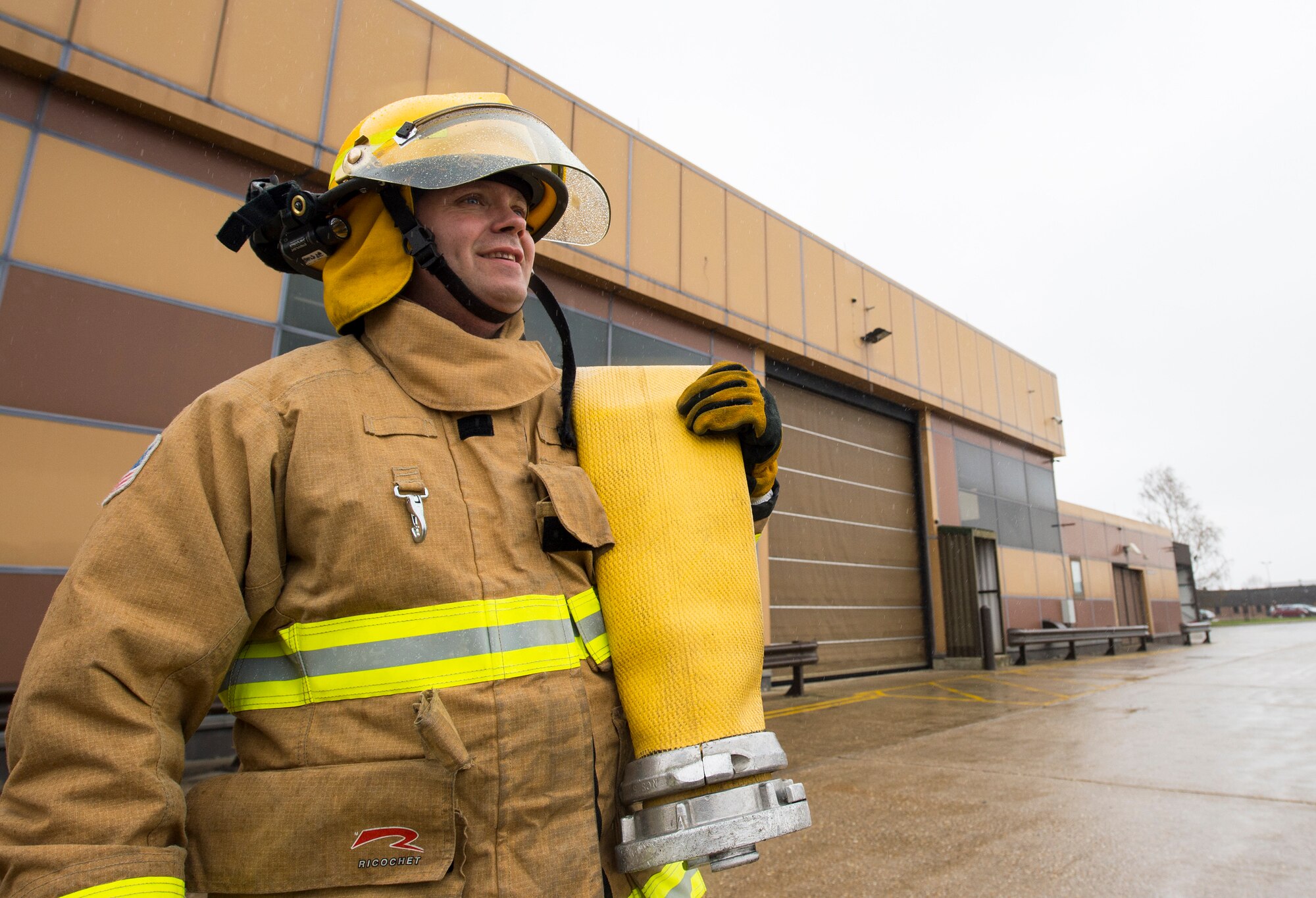 Firefighters with the 423rd Civil Engineer Squadron roll up a firehose during confined spaces training at RAF Alconbury, England on March 30, 2020. This type of training helps the firefighters maintain readiness and stay proficient in their craft. (U.S. Air Force photo by Master Sgt. Brian Kimball)