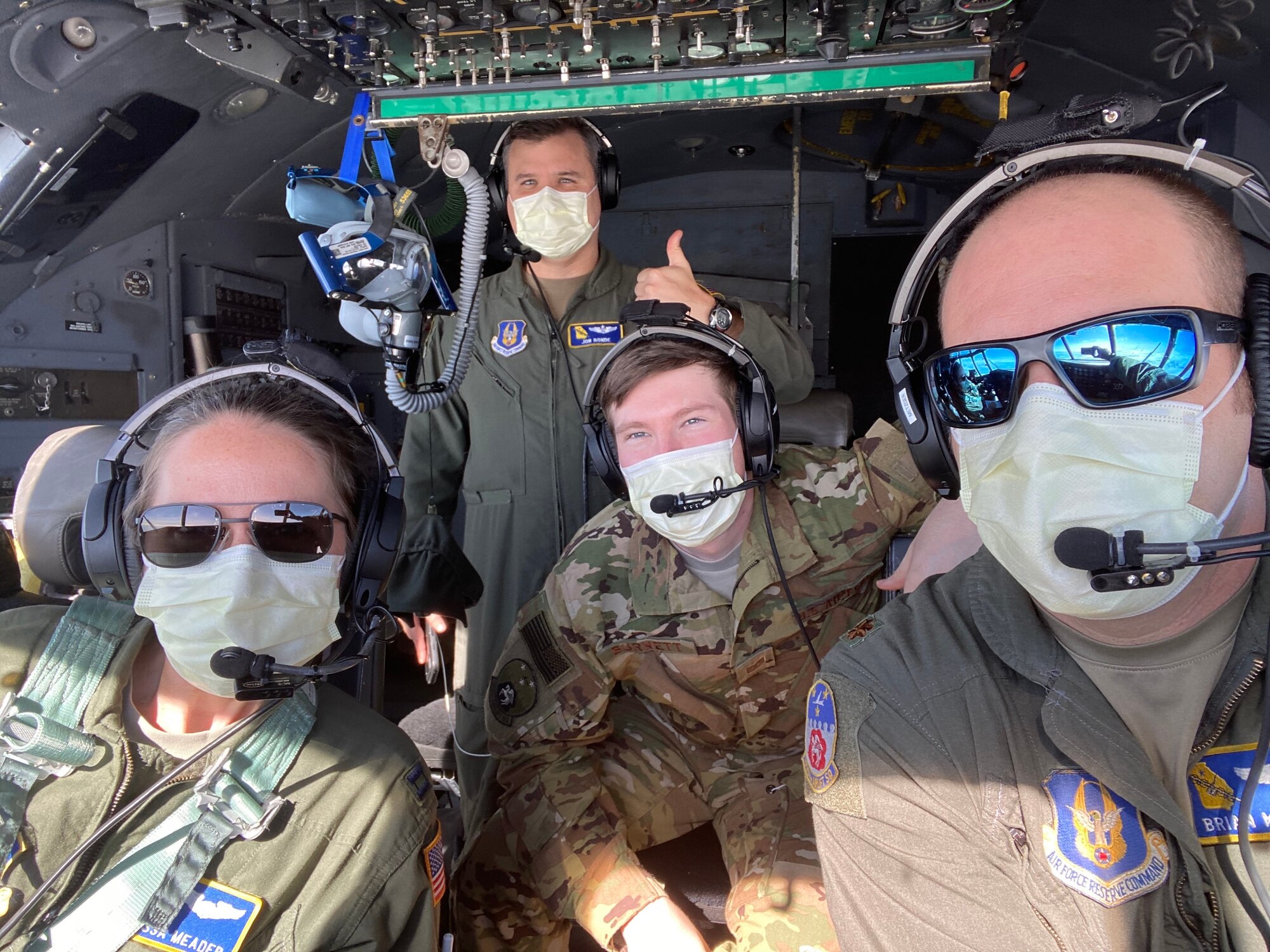 Aircrew members on a Dobbins C-130H3 Hercules pose for a photo wearing masks  on April 5, 2020.