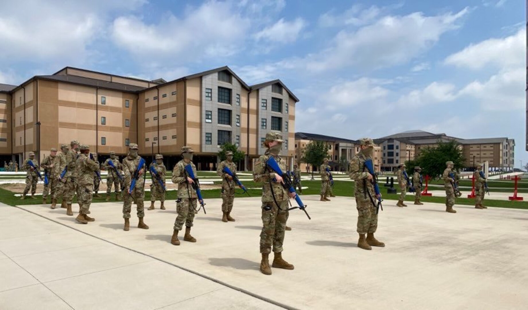 Trainees in basic military training (BMT) learn defensive fighting positions in preparation for BEAST (Basic Expeditionary Airman Skills Training) on Joint Base San Antonio-Lackland, Texas, April 8. This was the first day mask wear was implemented at BMT as a required safety measure during the COVID-19 pandemic.