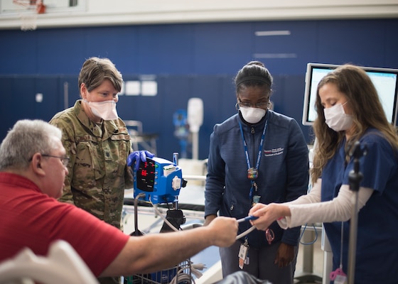 Delaware National Guard Citizen-Airmen and medical staff from Nemours/Alfred I. DuPont Hospital for Children, Christiana Care, and St. Francis Healthcare check vital signs during a training exercise at an alternate care site at A.I. DuPont Hospital, Wilmington, Del., April 7, 2020. Adults who do not have COVID-19 will be treated at the facility if hospitals reach capacity.