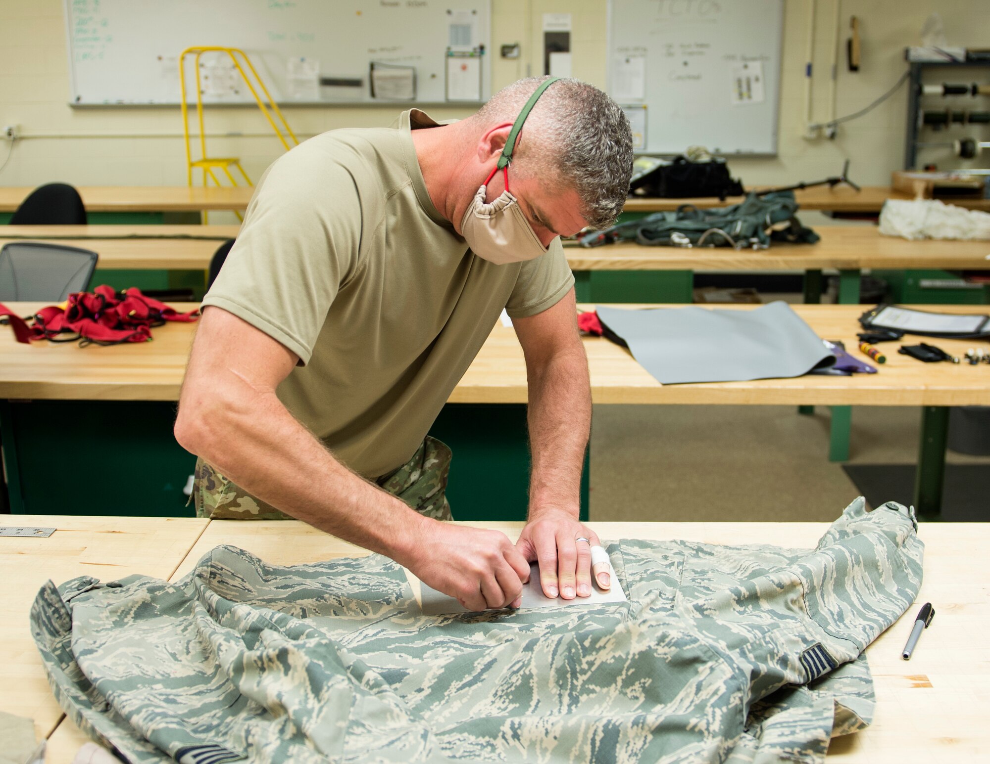 U.S. Air Force Airmen from the 133rd Operation Support Squadron’s aircrew flight equipment shop make masks for base personal in St. Paul, Minn., Apr. 8, 2020.
