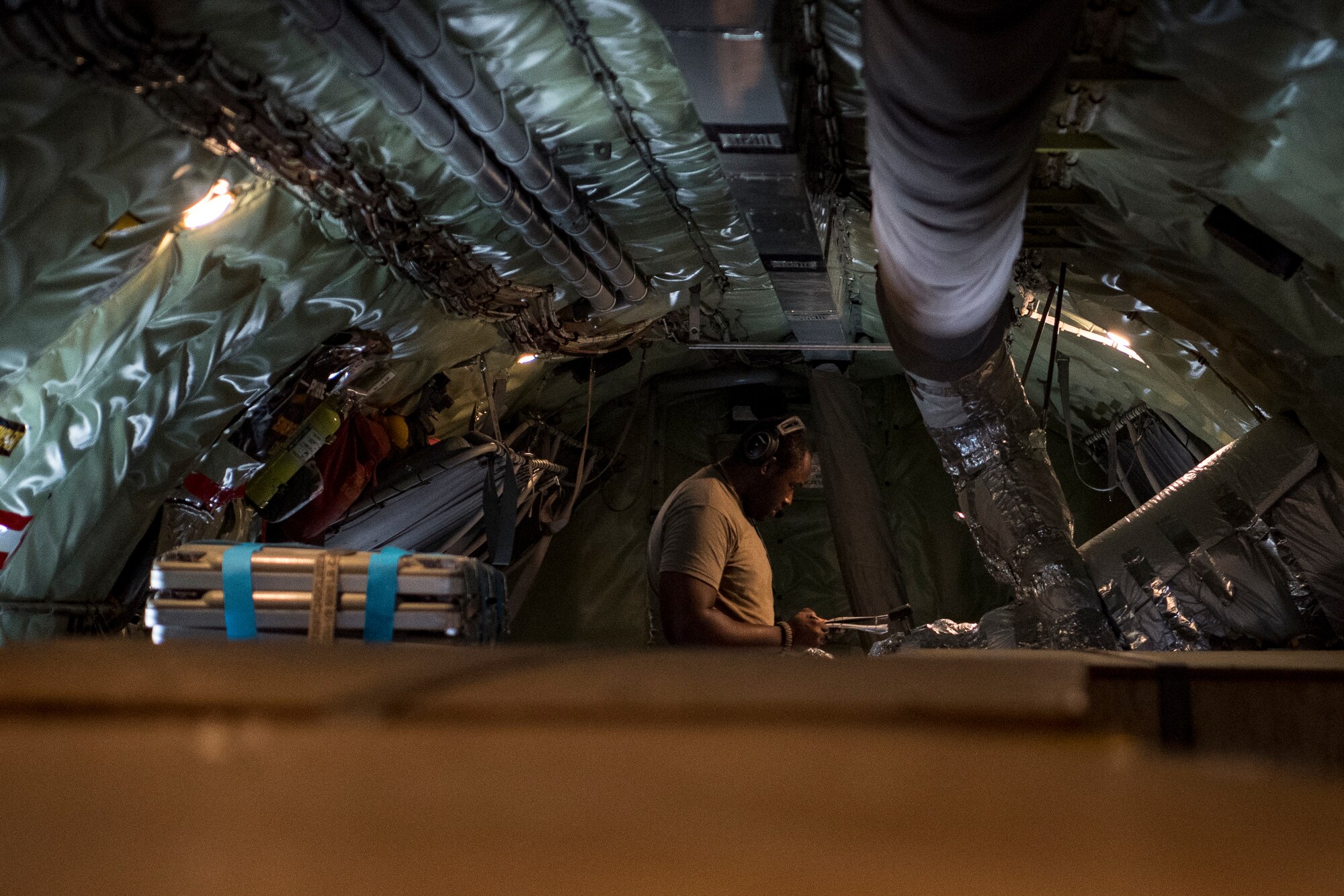 A U.S. Air Force KC-135 Stratotanker in-flight refueling specialist assigned to the 28th Expeditionary Air Refueling Squadron conducts preflight checklists at Al Udeid Air Base, Qatar, April 2, 2020.