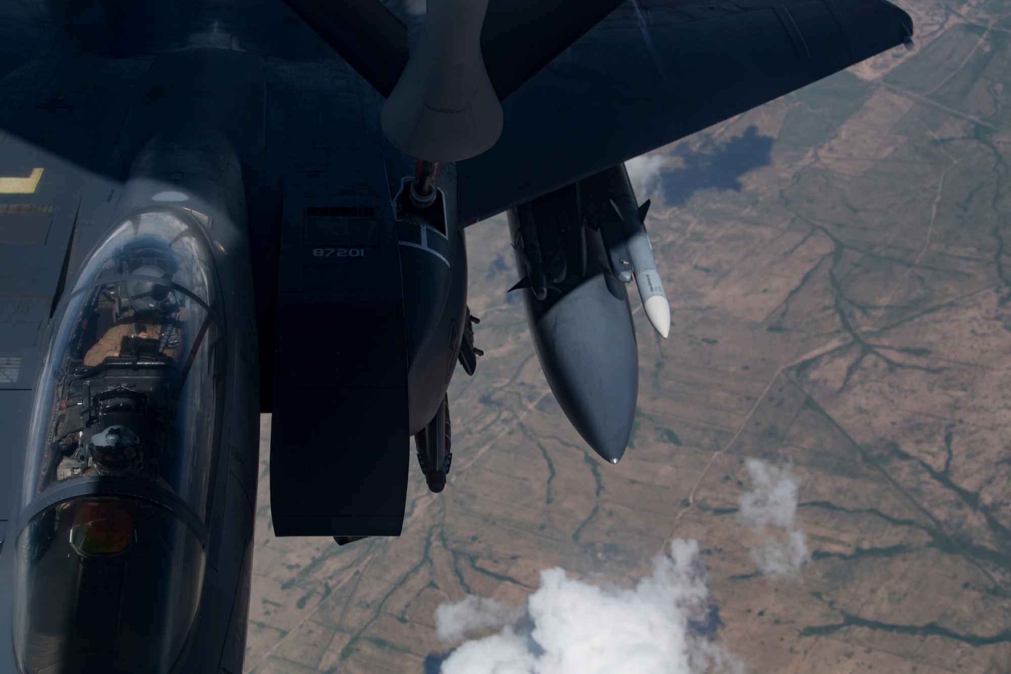 A U.S. Air Force KC-135 Stratotanker refuels a U.S. Air Force F-15E Strike Eagle above Iraq, April 2, 2020.