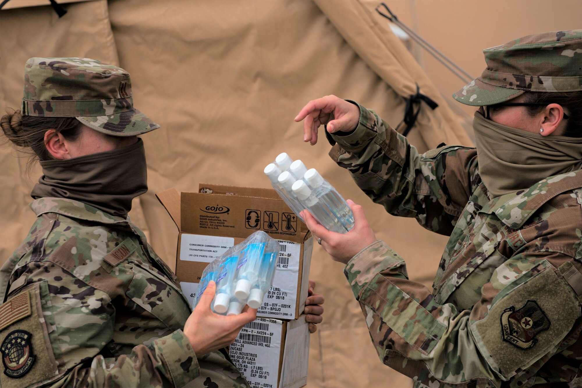 Airmen hand water to one another