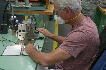 David Burgstiner, 437th Operations Support Squadron fabricator, sews masks together at Joint Base Charleston, S.C., April 8, 2020. The masks are intended to help mitigate the spread of infectious diseases. The shop started producing the masks earlier this week and have already made more than 500.