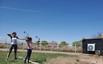 Master Sgt. Marci Montoya of the New Mexico National Guard practices archery with family at home to help stay resilient during the COVID-19 pandemic.