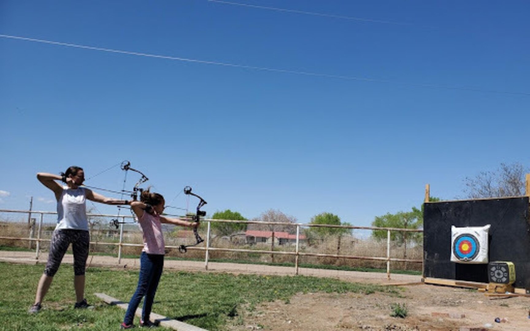 Master Sgt. Marci Montoya of the New Mexico National Guard practices archery with family at home to help stay resilient during the COVID-19 pandemic.