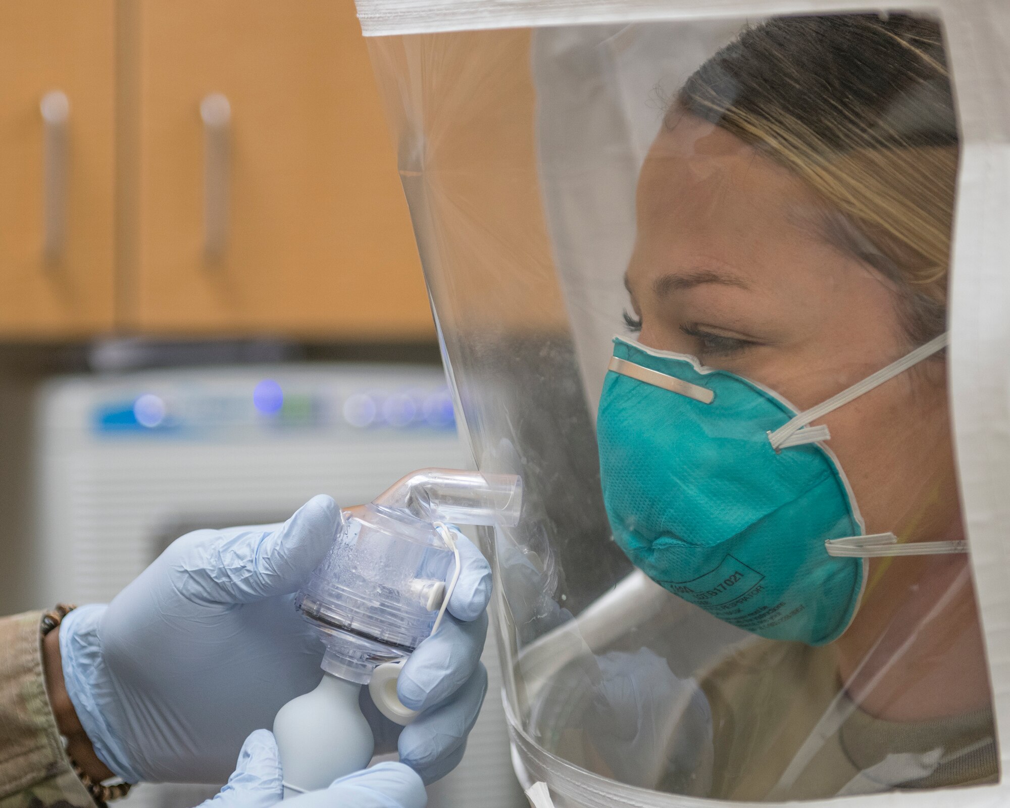 Staff Sgt. Beth Kenney, 56th Dental Squadron dental assistant, wears a N95 respirator mask while misted with a sensitivity and fit test solution April 1, 2020, at Luke Air Force Base, Ariz.