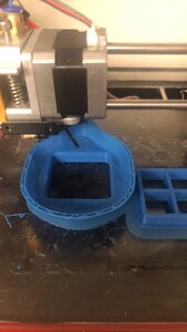 Metal printer with blue plastic mold.
