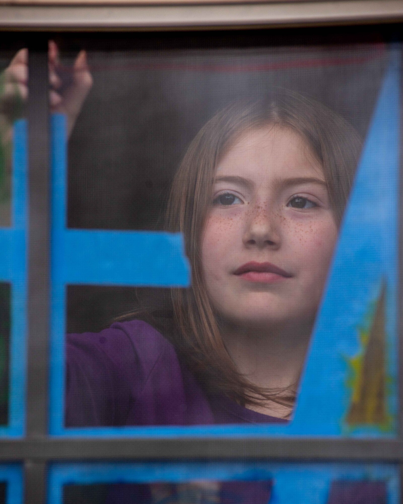 Valorie Carlton, 8, paints a window in her home April 6, 2020, at McConnell Air Force Base, Kansas. April is the Month of the Military Child, in dedication to the children who show their strength and resiliency while adjusting to the military lifestyle. (U.S. Air Force photo by Staff Sgt. Chris Thornbury)
