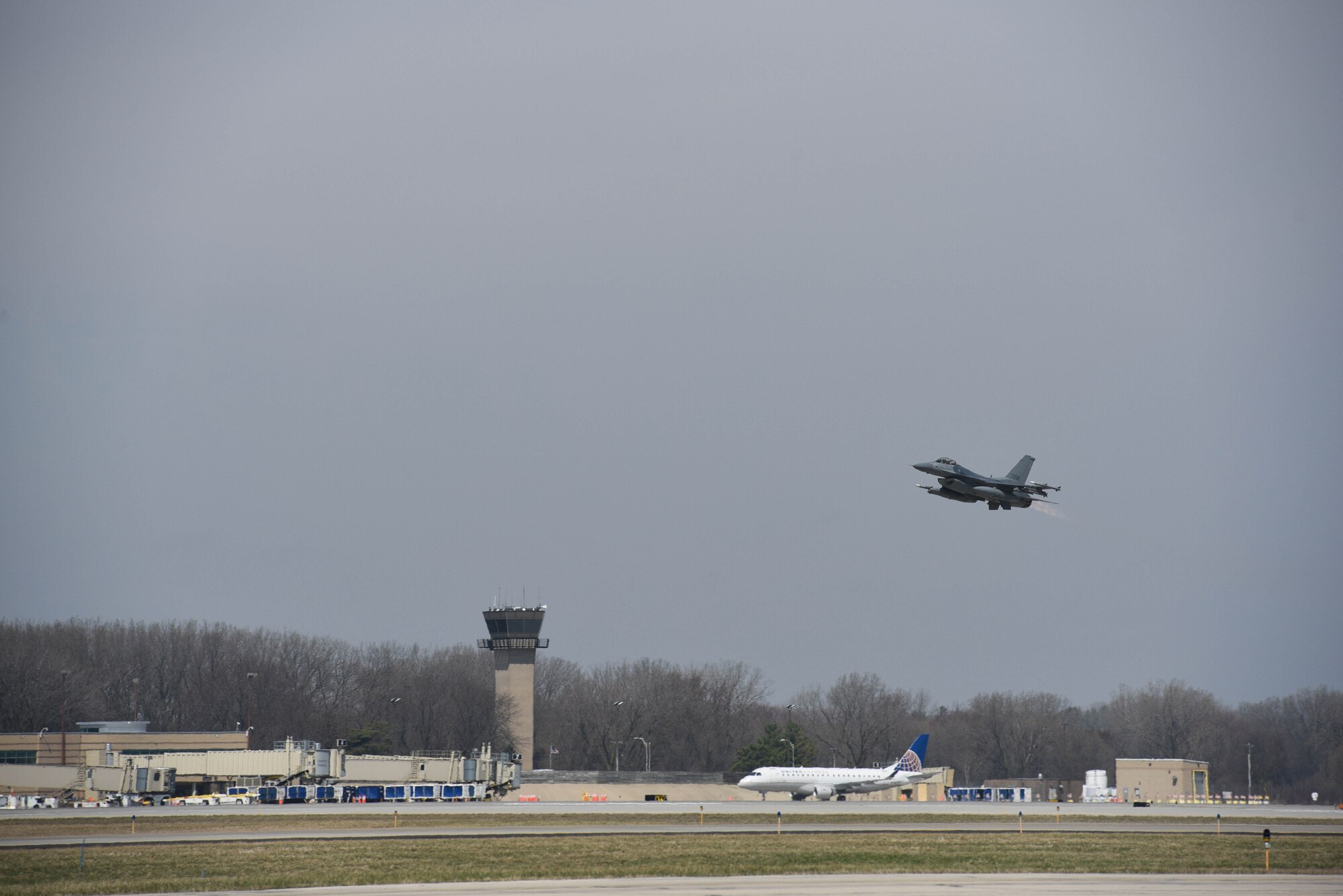 An F-16 Fighting Falcon from the 115th Fighter Wing takes off at Dane County Regional Airport, Madison, Wisconsin April 7, 2020.
