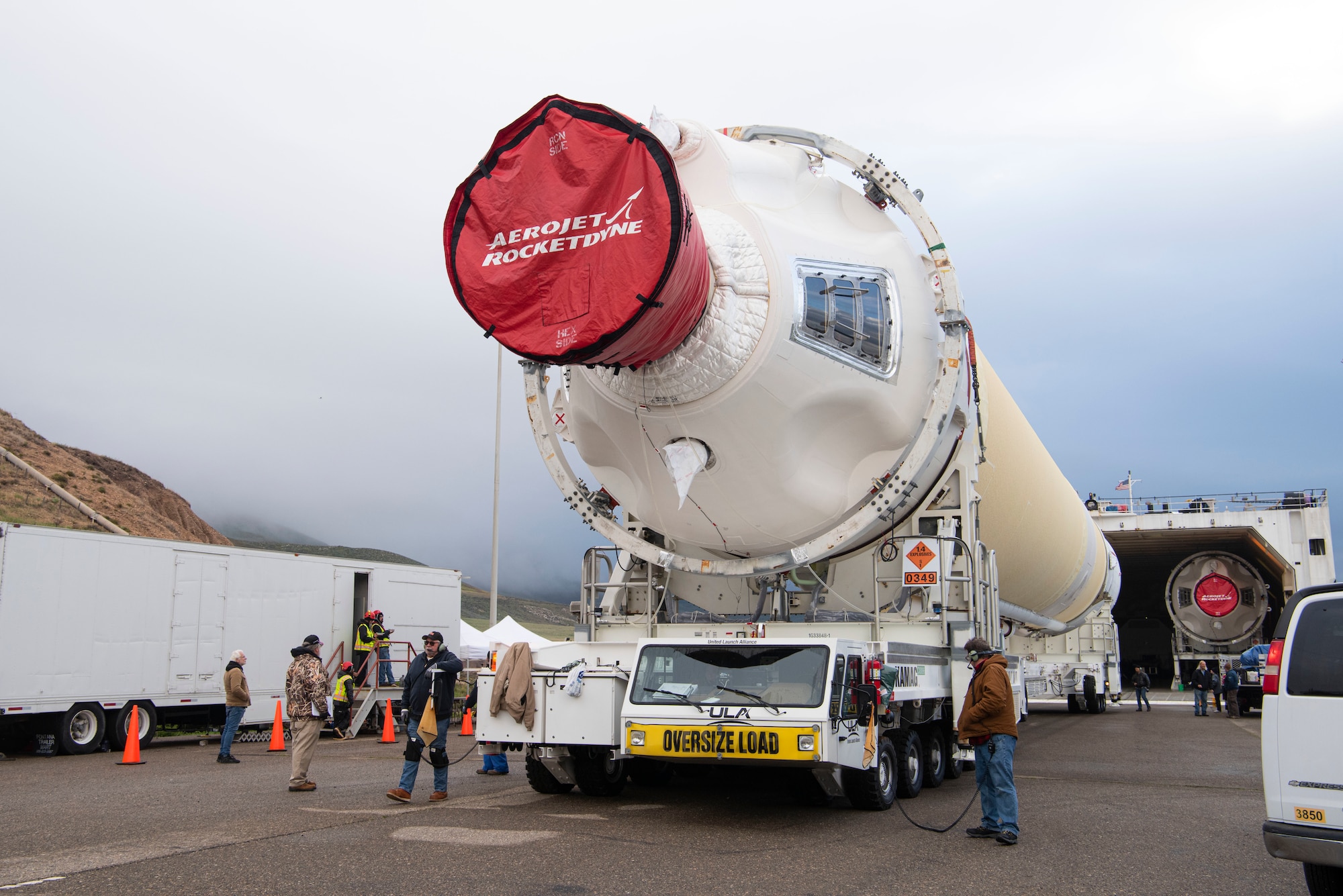 Mission partners and base members extract a Delta IV Heavy booster from a United Launch Alliance barge, known as the RocketShip, April 5, 2020, at Vandenberg Air Force Base, Calif. The barge docked at Vandenberg AFB to offload Delta IV Heavy boosters for an upcoming launch scheduled to occur later this year. The barge operation is a vital first step to executing the mission of assured access to space. (U.S. Air Force photo by Senior Airman Aubree Owens)