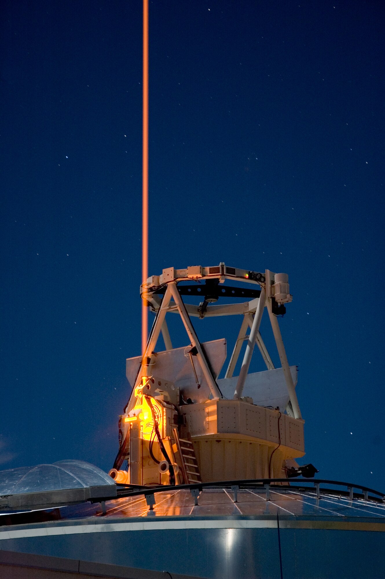 photo of a high tech piece of equipment pointed to the night sky