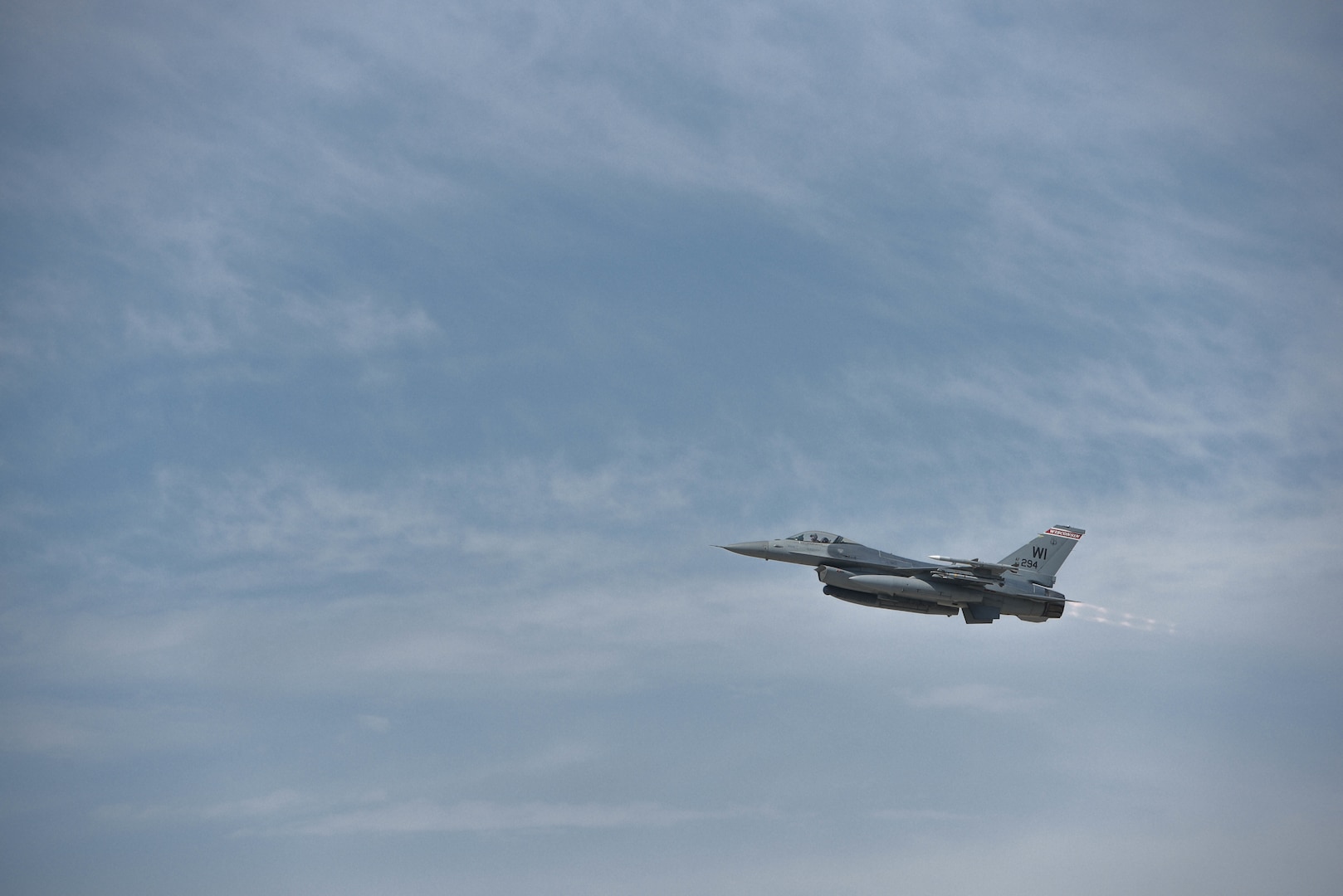 An F-16 Fighting Falcon from the 115th Fighter Wing, Wisconsin Air National Guard, takes off at Dane County Regional Airport, Madison, Wisconsin, April 7, 2020. The jet took off as part of a practice scramble for the Aerospace Control Alert mission.