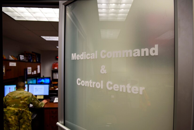 Photo of a sign on a door leading into the Medical Command and Control Center.