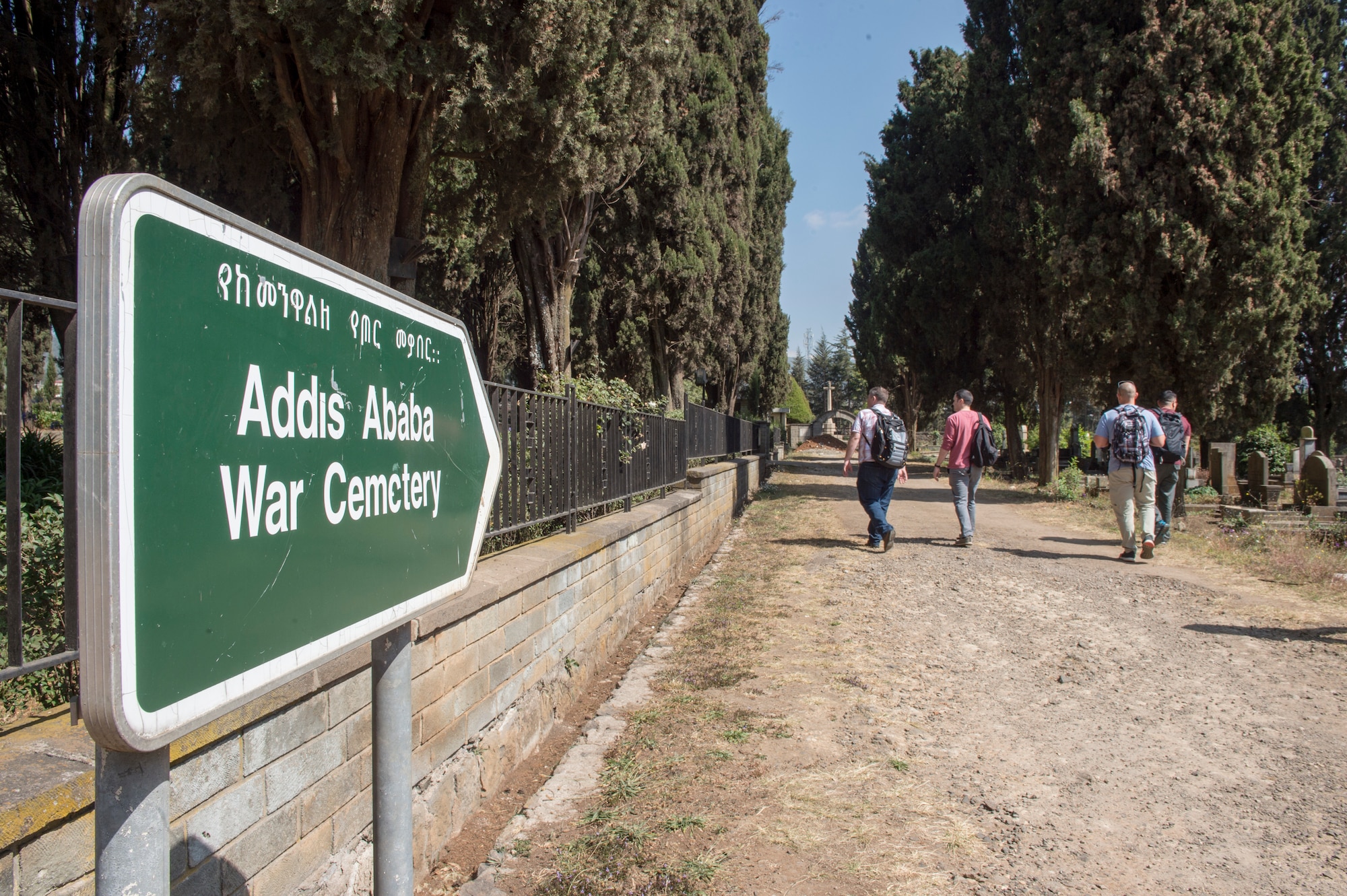 U.S. Airmen from the 818th Mobility Support Advisory Squadron visit the Addis Ababa War Cemetery in Ethiopia Jan. 11, 2020, to visit the grave site of John Robinson, a legendary aviator for Ethiopians and Americans. Robinson was an American-born Ethiopian air force colonel who  considered a national hero of Ethiopia who pioneered flight schools in the U.S. and Ethiopia. (U.S. Air Force photo by Staff Sgt. Sarah Brice)