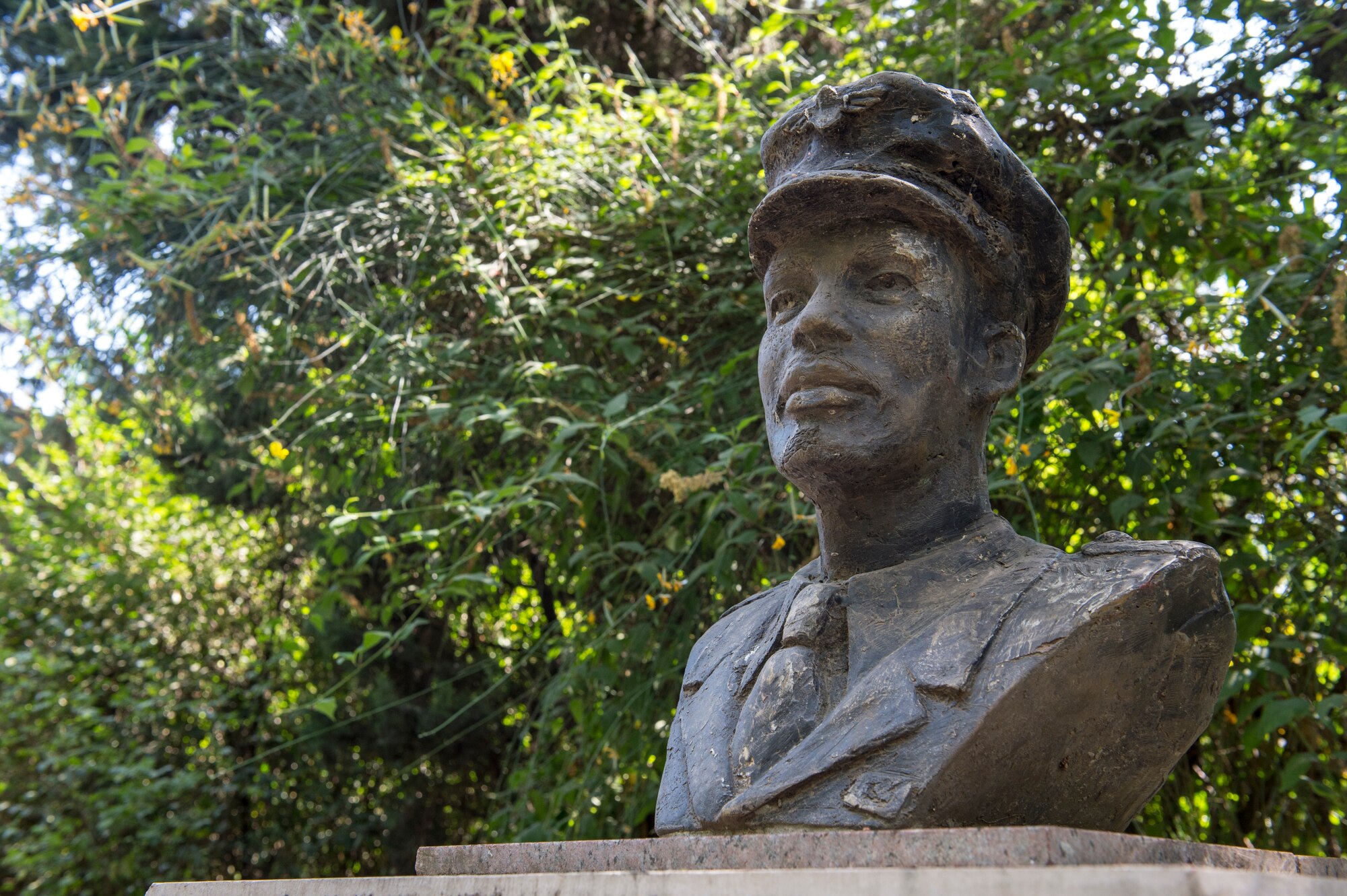 A bust of the American-born Ethiopian air force Col. John Robinson overlooks the Addis Ababa War Cemetery in Ethiopia Jan. 11, 2020. Robinson is considered a national hero of Ethiopia who pioneered flight schools in the U.S. and Ethiopia. (U.S. Air Force photo by Staff Sgt. Sarah Brice)