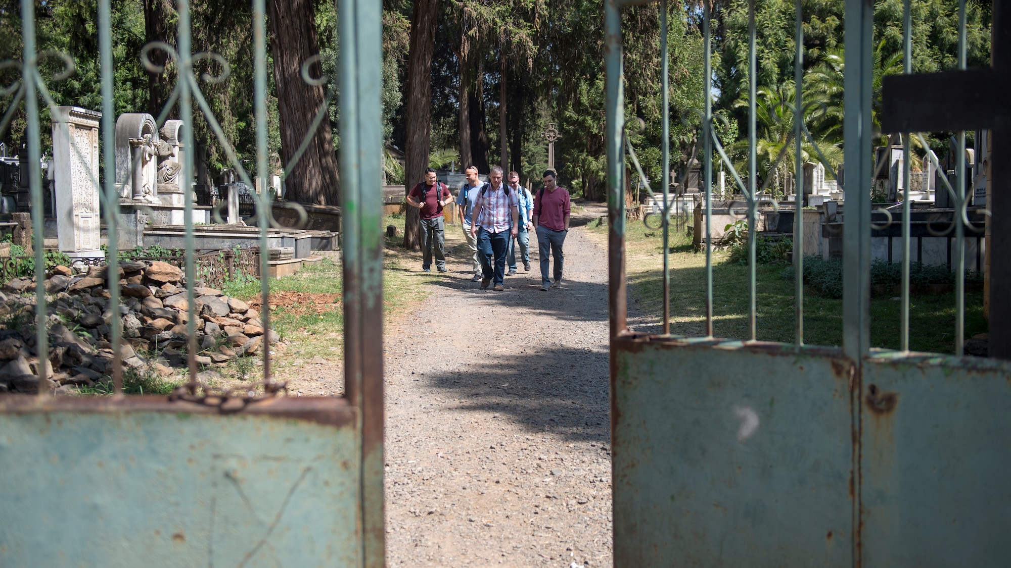 U.S. Airmen from the 818th Mobility Support Advisory Squadron depart the Addis Ababa War Cemetery in Ethiopia Jan. 11, 2020, after visiting the grave site of John Robinson, a legendary aviator for Ethiopians and Americans. The 818th MSAS is comprised of more than 28 Air Force specialties who advise, assist, and train foreign military partners in Africa. (U.S. Air Force photo by Staff Sgt. Sarah Brice)