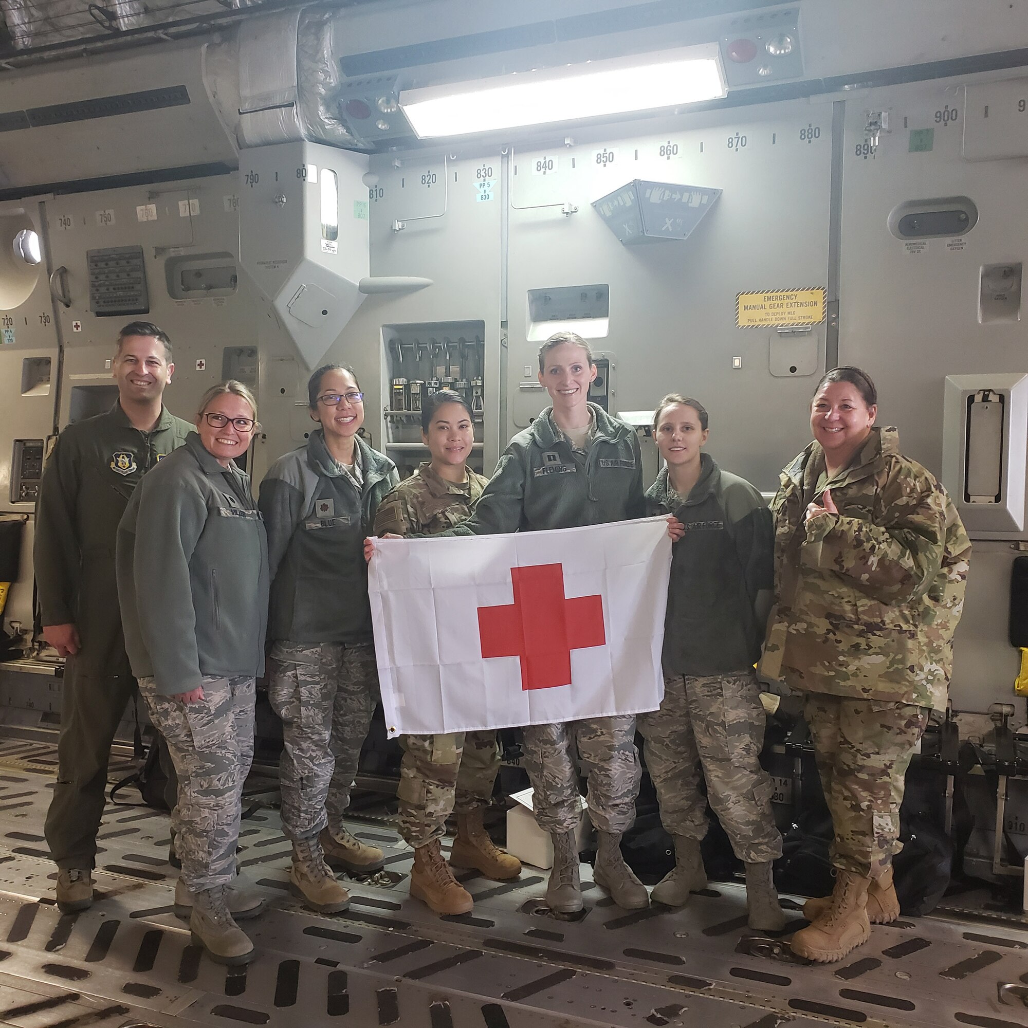 A doctor and several nurses from the 445th Airlift Wing’s Aerospace Medicine and Aeromedical Staging Squadrons, pose on board a C-17 Globemaster III here April 5, 2020 before heading to Joint Base McGuire-Dix-Lakehurst. The Airmen were notified April 4, 2020 that they would be mobilized to New York City to help with the COVID-19 pandemic. The team is currently assigned to Lincoln Hospital.