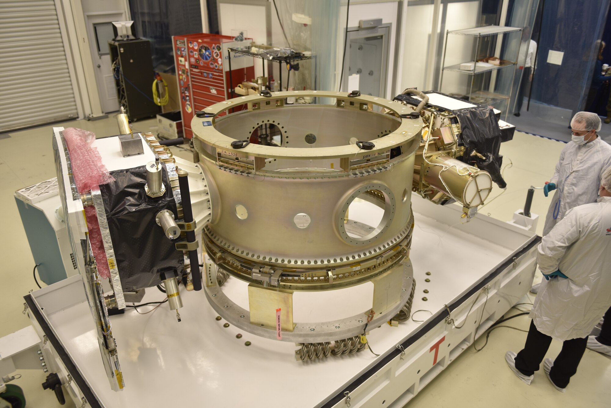 photo of a large piece of satellite equipment in a laboratory