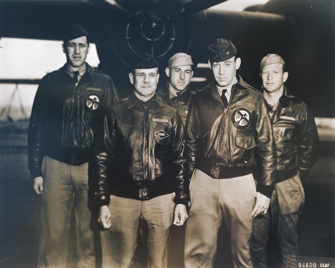 Men pose for a group photo.