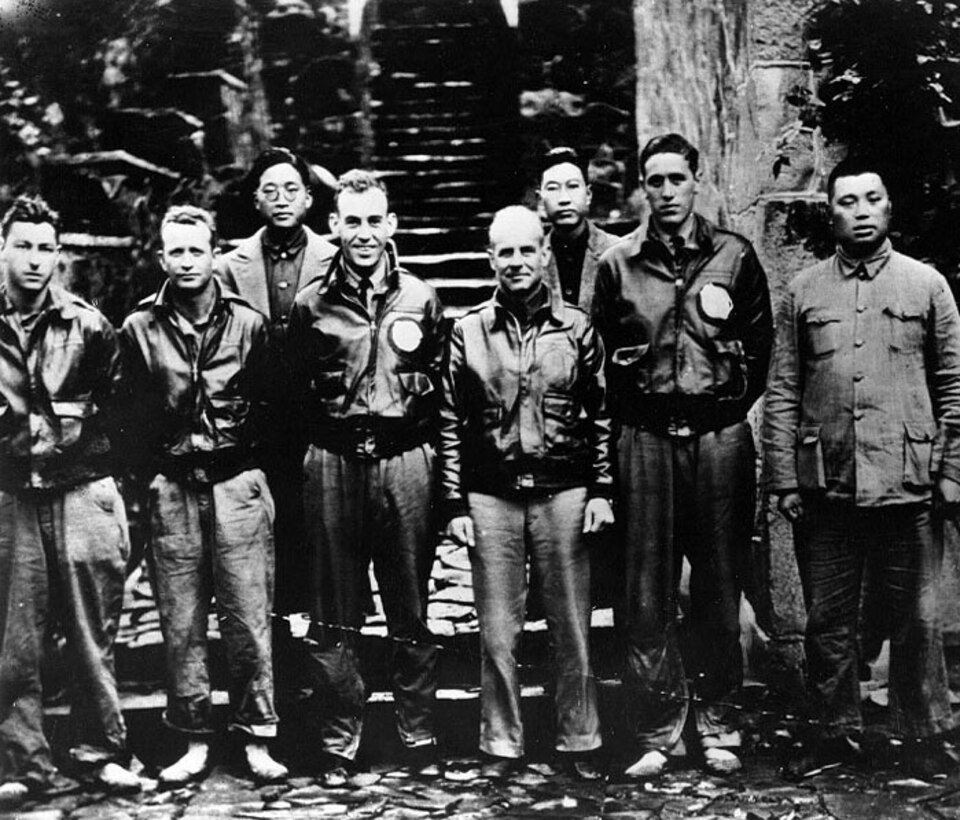 Men pose for a group photo.