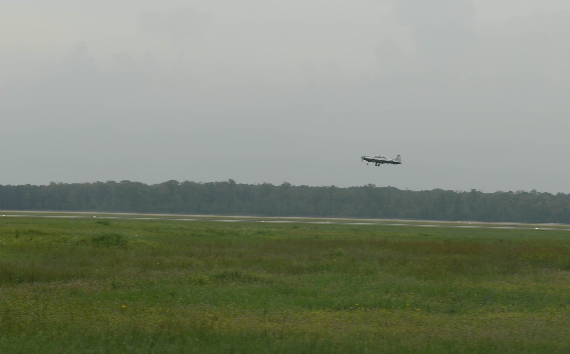 A T-6A Texan II takes off April 8, 2020, from Columbus Air Force Base, Miss. The T-6 is a single-engine, two-seat primary trainer, and is currently being used as pilot training continues amid the COVID-19 pandemic. (U.S. Air Force photo by Airman 1st Class Davis Donaldson)