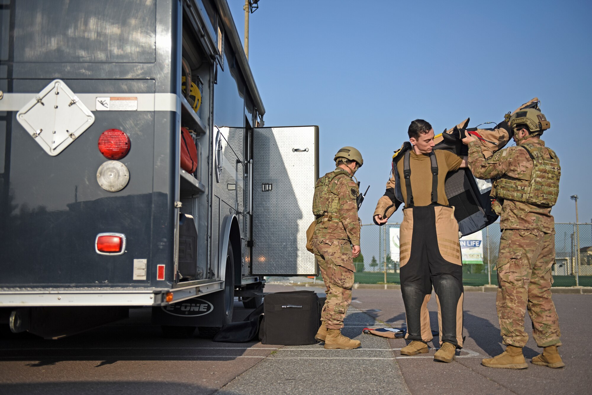 Staff Sgt. Tyler McMillan Wammack, 8th Civil Engineer Squadron Explosive Ordnance Disposal technician, puts on a bomb suit prior to entering the base post office during a training event at Kunsan Air Base, Republic of Korea, April 8, 2020. Training benefits EOD technicians by giving them the opportunity to gain experience on how improvised explosive devices are built and how best to identify them in the field. (U.S. Air Force photo by Staff Sgt. Mackenzie Mendez)