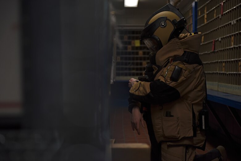 Staff Sgt. Tyler McMillan Wammack, 8th Civil Engineer Squadron Explosive Ordnance Disposal technician, identifies the simulated improvised explosive device at the base post office during a training event at Kunsan Air Base, Republic of Korea, April 8, 2020. Training benefits EOD technicians by giving them the opportunity to gain experience on how IEDs are built and how best to identify them in the field. (U.S. Air Force photo by Staff Sgt. Mackenzie Mendez)